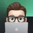 Memoji of Ryan Furrer behind a laptop